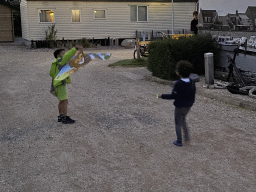 Max and his friend playing with a kite at the Oosterschelde Camping Stavenisse, at sunset