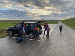 Max flying a kite and our friends at the parking lot at the Dijkweg road