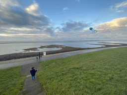 Max flying a kite and our friends at the staircase to the beach near the Dijkweg road