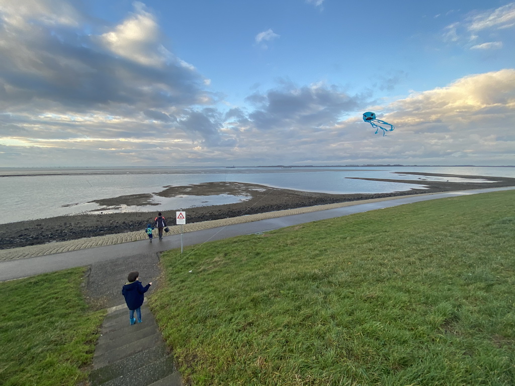Max flying a kite and our friends at the staircase to the beach near the Dijkweg road
