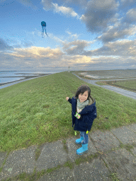 Max flying a kite at the dyke near the Dijkweg road