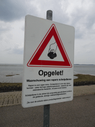 Warning sign for catching seashells at the beach near the Dijkweg road