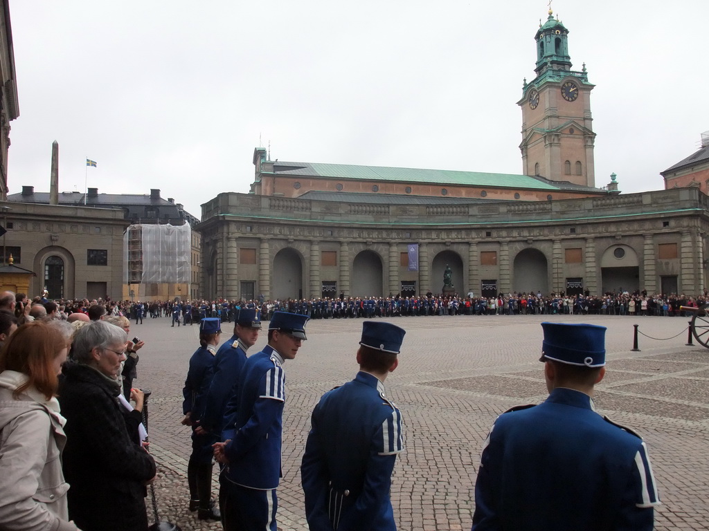 Changing of the guards, at the Outer Court of the Stockholm Palace, and the tower of the Saint Nicolaus Church