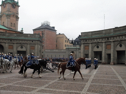 Changing of the guards, at the Outer Court of the Stockholm Palace, and the tower of the Saint Nicolaus Church