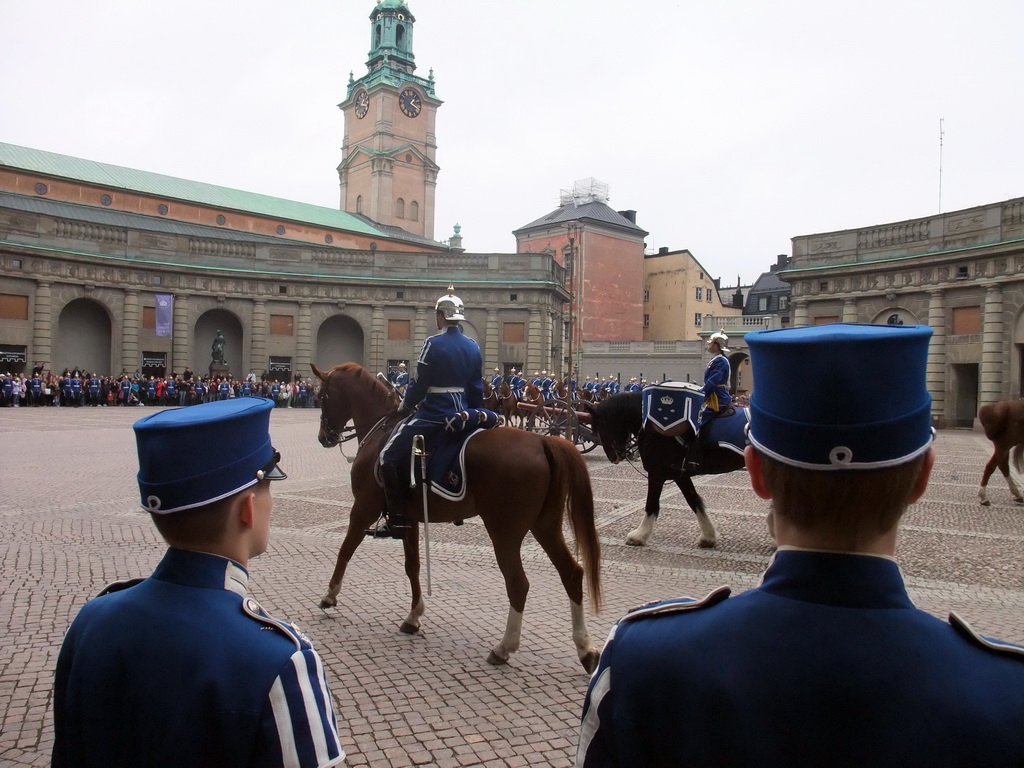 Changing of the guards, at the Outer Court of the Stockholm Palace, and the tower of the Saint Nicolaus Church