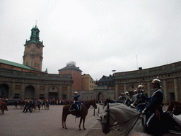 Changing of the guards, at the Outer Court of the Stockholm Palace, and the tower of the Saint Nicolaus Church