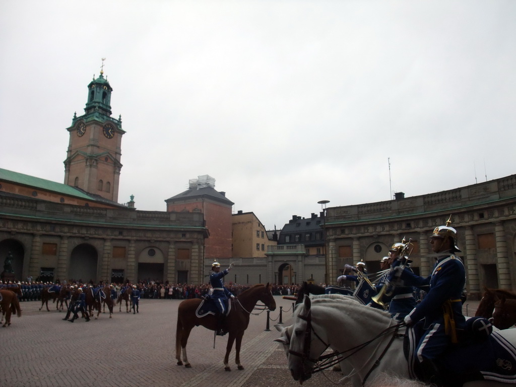 Changing of the guards, at the Outer Court of the Stockholm Palace, and the tower of the Saint Nicolaus Church