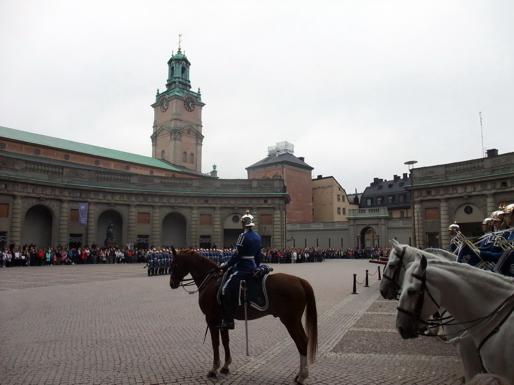 Changing of the guards, at the Outer Court of the Stockholm Palace, and the tower of the Saint Nicolaus Church