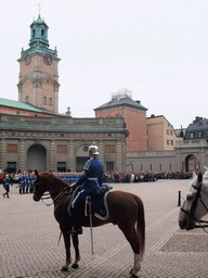 Changing of the guards, at the Outer Court of the Stockholm Palace, and the tower of the Saint Nicolaus Church