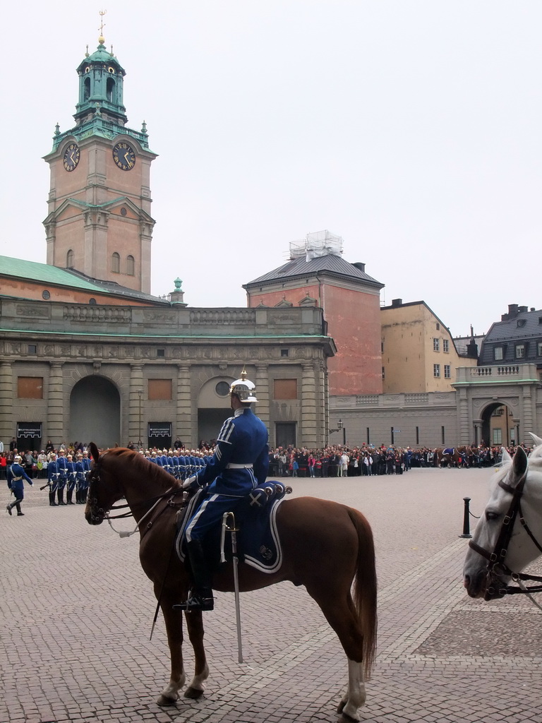 Changing of the guards, at the Outer Court of the Stockholm Palace, and the tower of the Saint Nicolaus Church