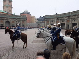 Changing of the guards, at the Outer Court of the Stockholm Palace, and the tower of the Saint Nicolaus Church