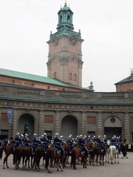 Changing of the guards, at the Outer Court of the Stockholm Palace, and the tower of the Saint Nicolaus Church