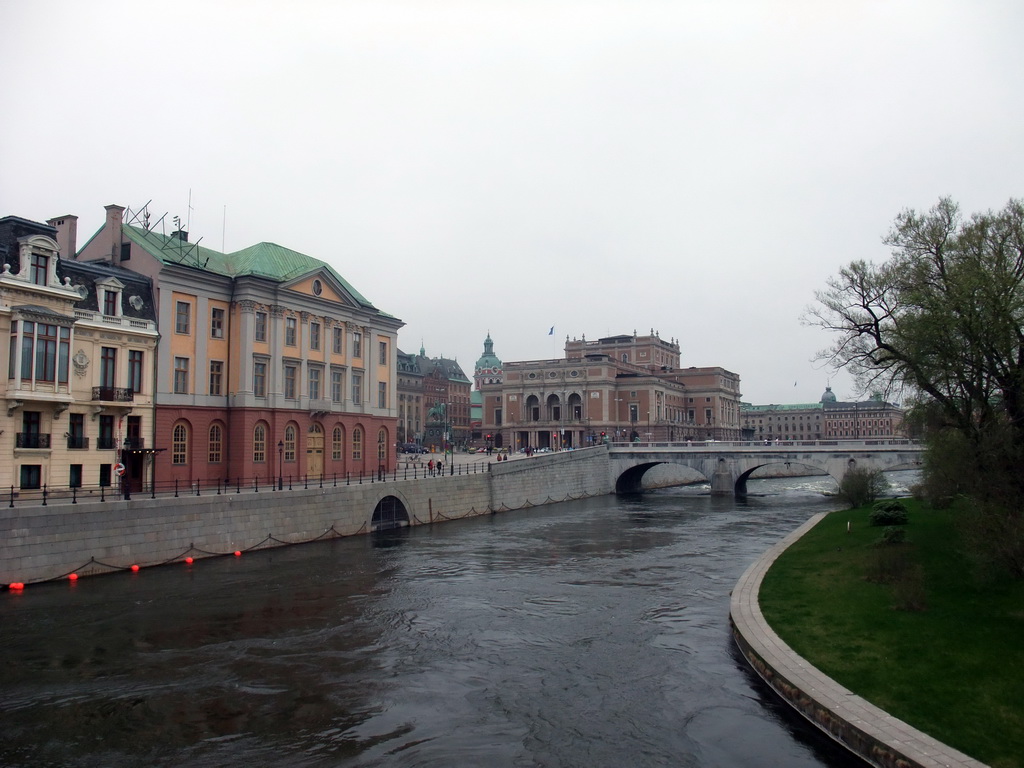 The Norrbro bridge over the Norrström river, the Royal Swedish Opera (Kungliga Operan) and the tower of the Saint James`s Church (Sankt Jacobs kyrka), viewed from the Riksbron bridge