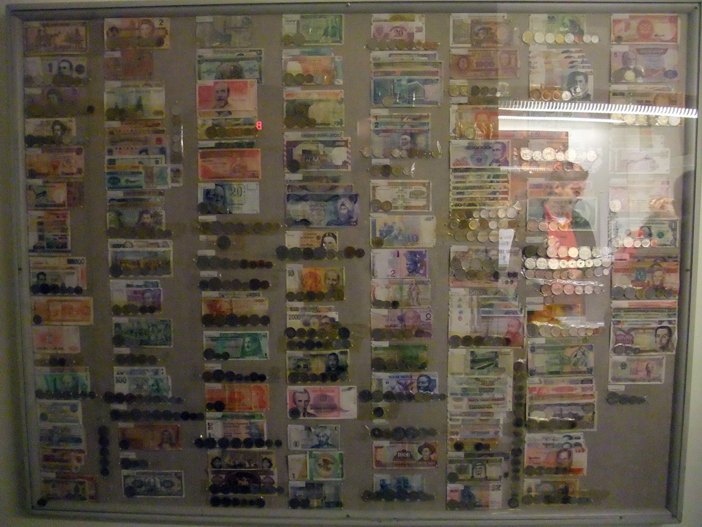 Overview of coins and banknotes, in front of the elevator to the main tower of the Stockholm City Hall