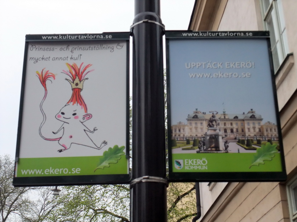 Commercial posters at a lamppost in Hantverkargatan street