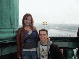 Tim and Miaomiao on top of the main tower of the Stockholm City Hall, with a view on the Gamla Stan and Södermalm neighborhoods