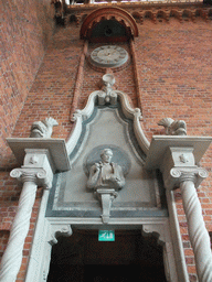 Relief and clock above door in the Blue Hall of the Stockholm City Hall