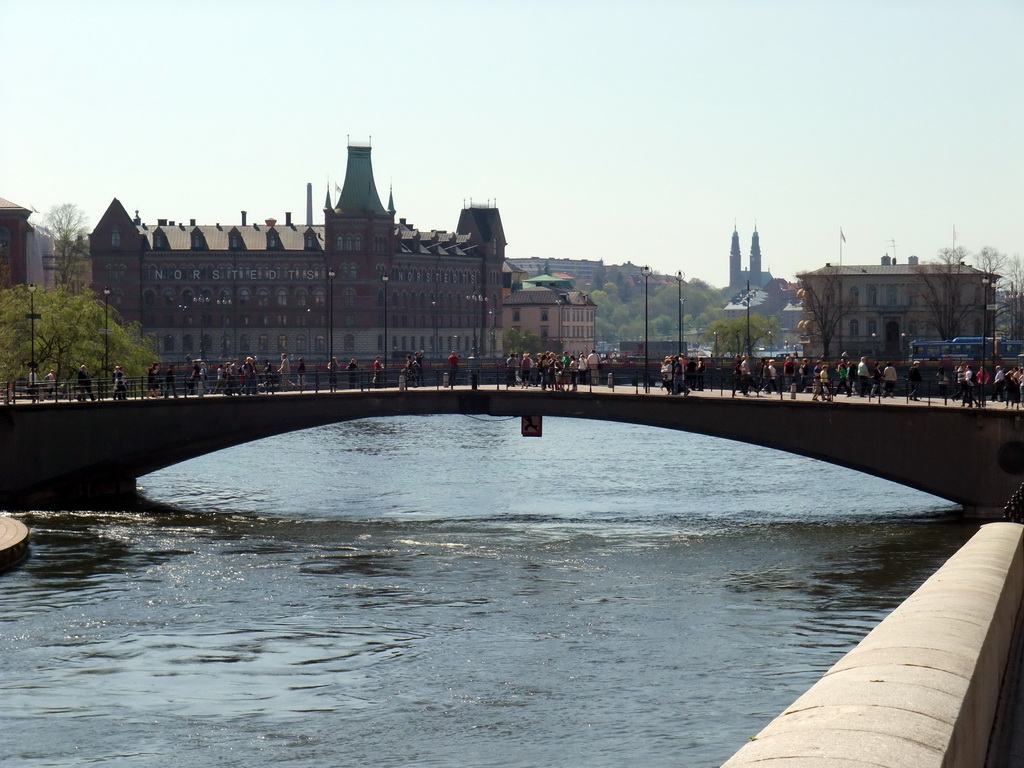 The Riksbron bridge over the Norrström river, the Norstedt Building (Norstedthuset), the Högalid Church and the Strömsborg castle