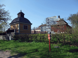 Old Swedish houses and a fingerpost in the Skansen open air museum