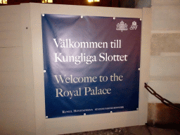 Banner in front of the Stockholm Palace, by night