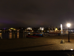 Boats in the Stockholms Ström river, viewed from the Skeppsbron street, by night