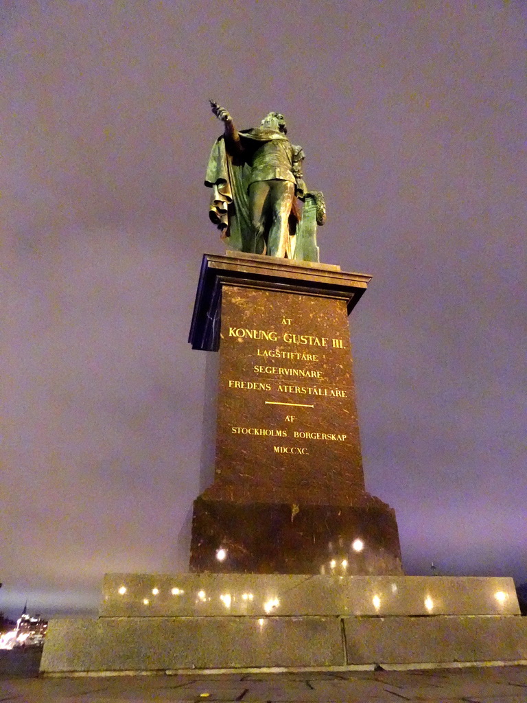 Statue of King Gustav III of Sweden at the Skeppsbron street, by night