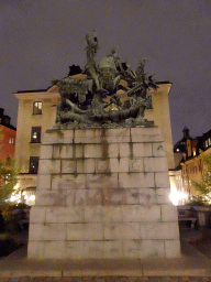 Statue of Saint George and the Dragon at the Köpmanbrinken square, by night