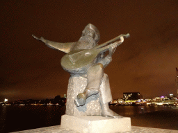 Statue of Evert Taube at the Evert Taubes Terrass park, by night