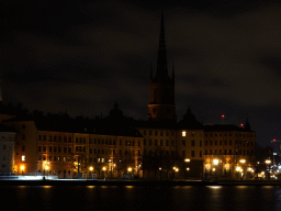 The Riddarholmen island with the Riddarholmen Church, viewed from the Stadshusparken park, by night