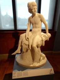 Statue `Shepherd, Sitting on a Rock` by Johan Peter Molin at the 1800-1870 exhibition at the Middle Floor of the Nationalmuseum, with explanation