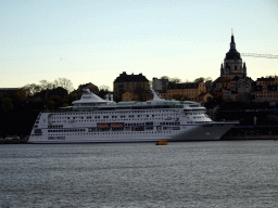 Boat in the Stockholms Ström river and the Katarina Church, viewed from the Skeppsholmbron bridge