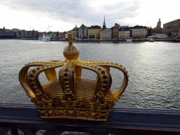 Crown at the Skeppsholmbron bridge, with a view on the Stockholms Ström river, the German Church and the Saint Nicolaus Church