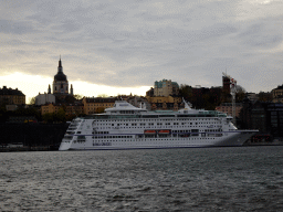 Boat in the Stockholms Ström river and the Katarina Church, viewed from the Kastellholmsbron bridge