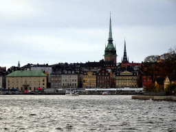 Boats in the Stockholms Ström river, the German Church and the Riddarholmen Church, viewed from the Kastellholmsbron bridge