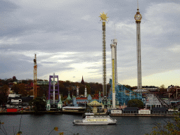 Boat in the Stockholms Ström river, the Gröna Lund amusement park, viewed from the Kastellholmen island