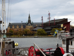 Boats in the Stockholms Ström river, the Nordic Museum and the Vasa Museum, viewed from the Östra Brobänken street at the Skeppsholmen island