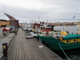 Boats at the docks at the Östra Brobänken street at the Skeppsholmen island