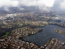 Boats in the Lane Cove River and skyscrapers at North Sydney, viewed from the airplane from Cairns
