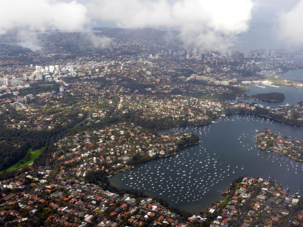 Boats in the Lane Cove River and skyscrapers at North Sydney, viewed from the airplane from Cairns