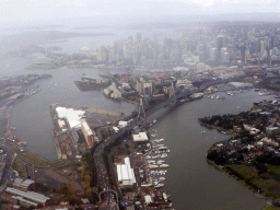 The Anzac Bridge, White Bay, Johnstons Bay, Rozelle Bay, Blackwattle Bay, Darling Harbour, the Sydney Harbour Bridge, the Sydney Opera House and skyscrapers in the city center, viewed from the airplane from Cairns