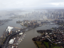 The Anzac Bridge, White Bay, Johnstons Bay, Rozelle Bay, Blackwattle Bay, Darling Harbour, the Sydney Harbour Bridge, the Sydney Opera House and skyscrapers in the city center, viewed from the airplane from Cairns