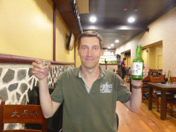 Tim with a bottle of Soju at the Dae Jang Kum Korean BBQ restaurant
