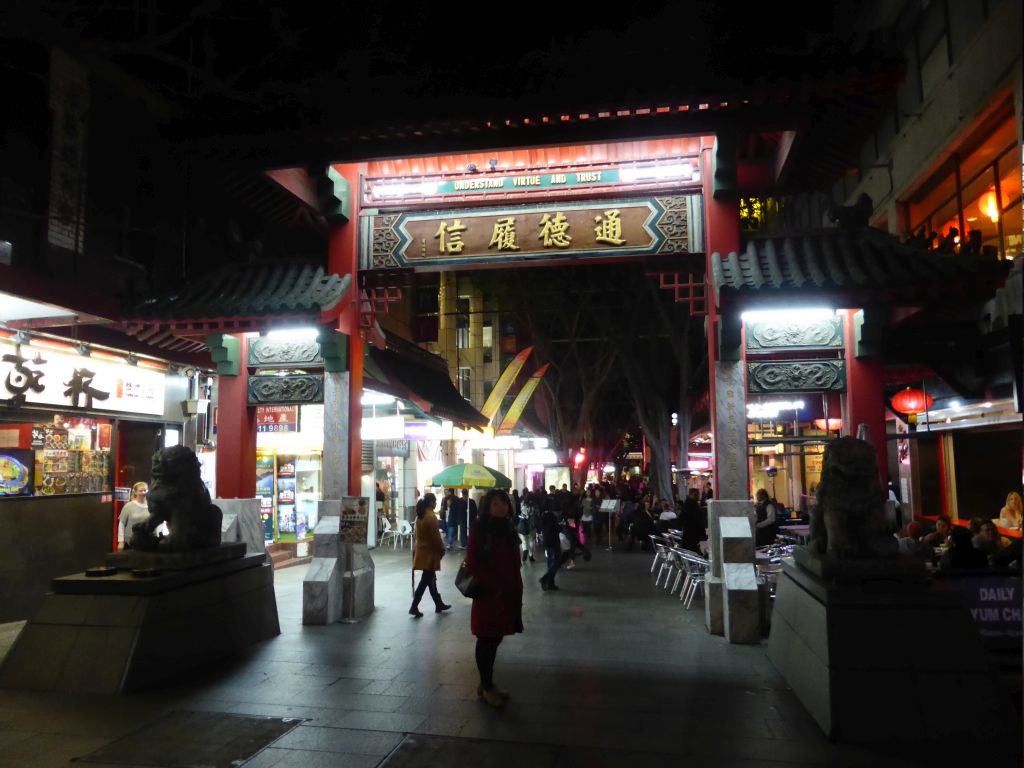 Miaomiao in front of the northern Chinatown Gate at Dixon Street, by night