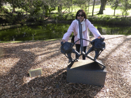 Miaomiao with the sculpture `Mirroring` by Keld Moseholm, at the Royal Botanic Gardens
