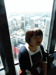 Miaomiao at the Sydney Tower, with a view on the skyscrapers in the city center and the Sydney Harbour Bridge over the Sydney Harbour