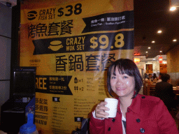 Miaomiao with a drink at the Crazy Wings restaurant at Dixon Street