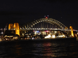 The Sydney Cove, the Sydney Harbour Bridge and Luna Park Sydney, viewed from the Lower Concourse of the Sydney Opera House, by night