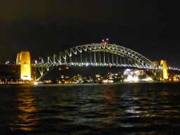 The Sydney Cove, the Sydney Harbour Bridge and Luna Park Sydney, viewed from the Lower Concourse of the Sydney Opera House, by night