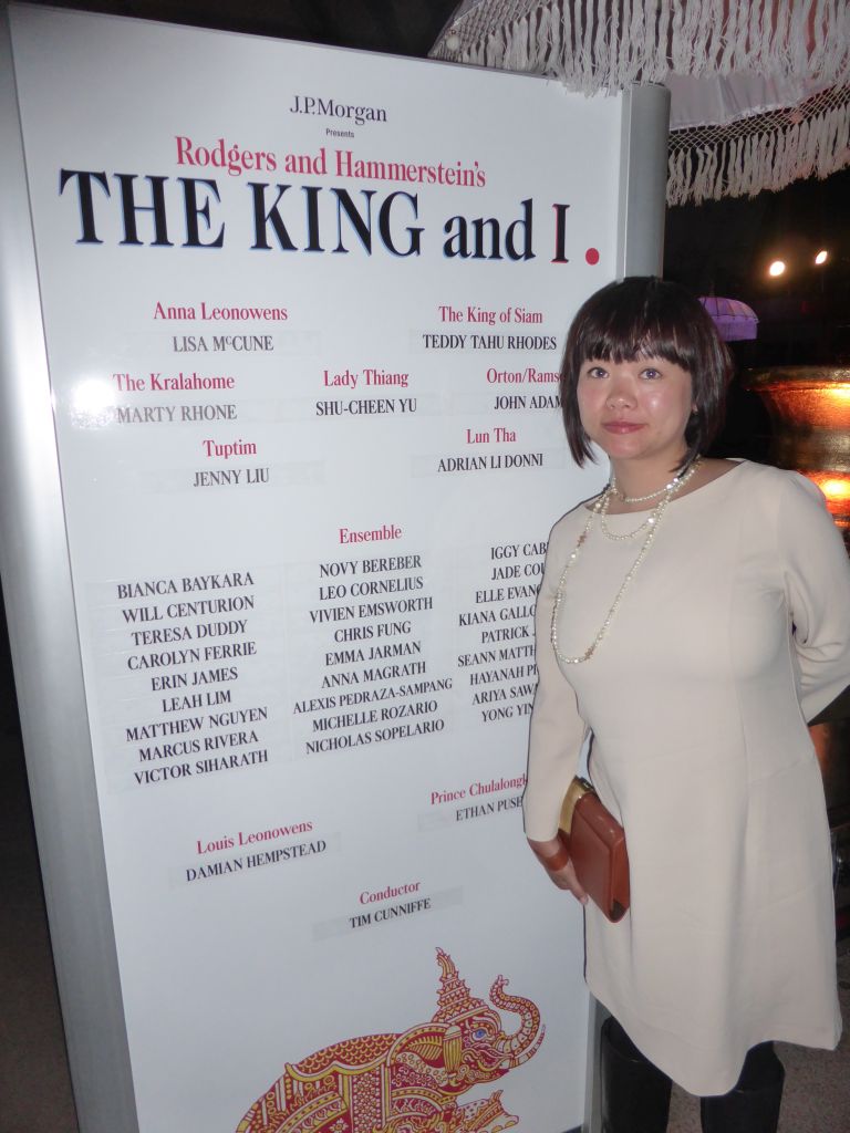 Miaomiao with a poster of the musical `The King and I` by Rodgers and Hammerstein, in the Lobby of the Joan Sutherland Theatre at the Sydney Opera House