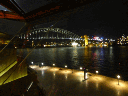 The Sydney Cove and the Sydney Harbour Bridge, viewed from the Northern Foyer of the Joan Sutherland Theatre at the Sydney Opera House, by night